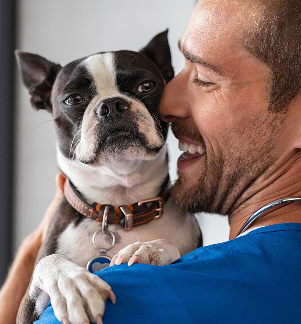 Doctor Snuggling With Dog