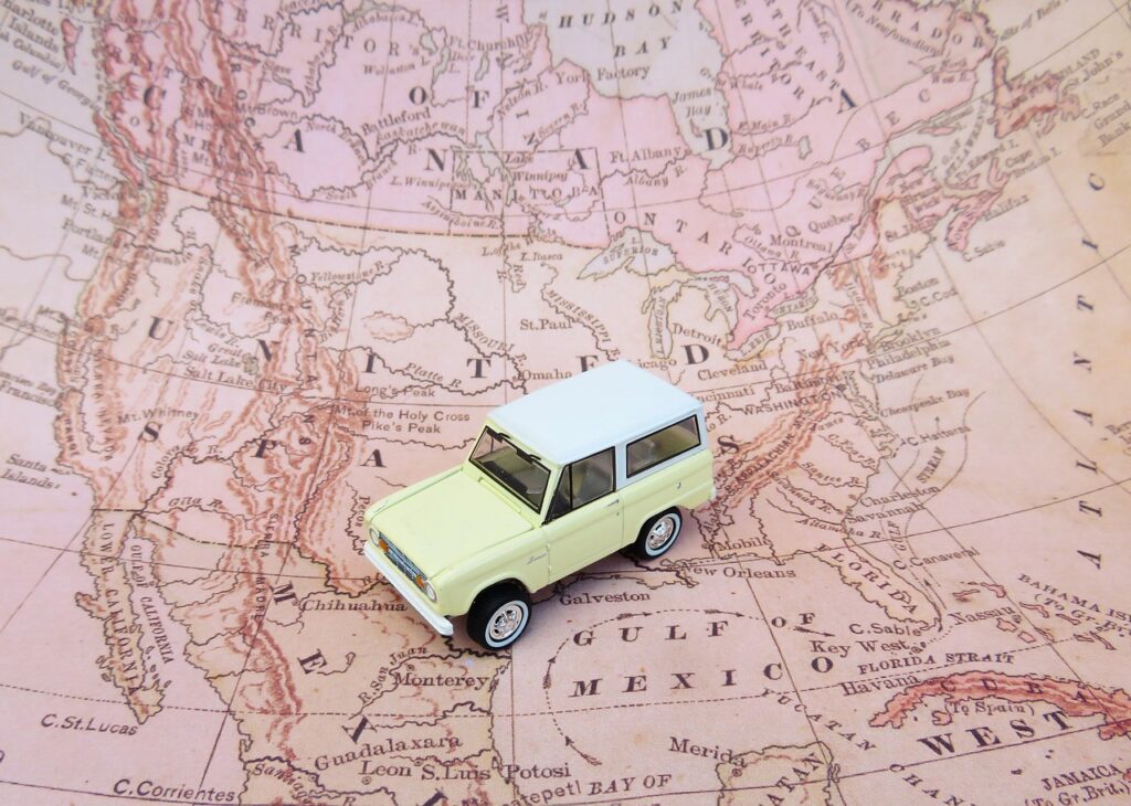 A toy car on a map of North America