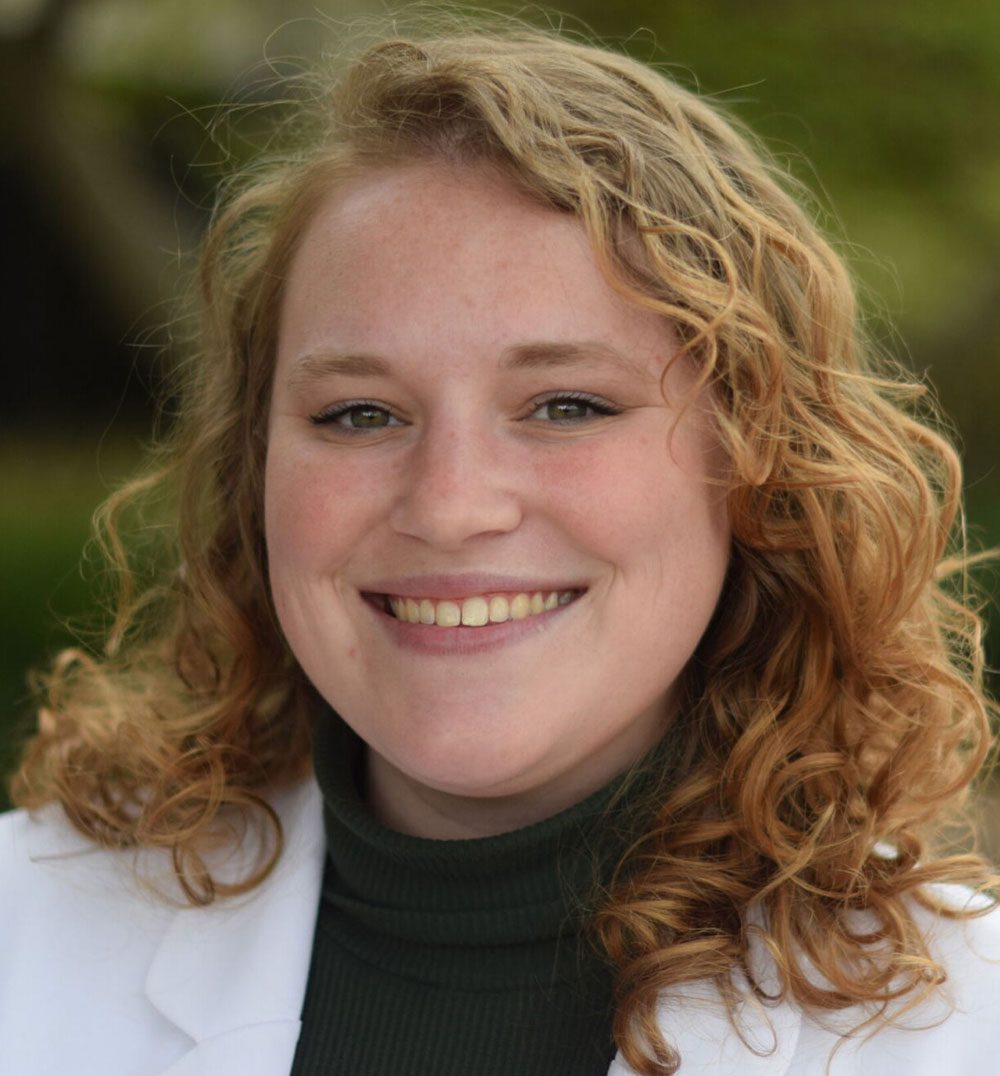Dr. Allen-Schult posing for a picture outside